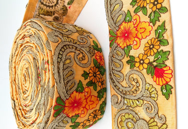 Peach Art Silk Fabric Trim With Orange, Green, Red And Gold Floral Embroidery